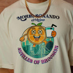 T-shirt with a colorful graphic design featuring an orange character and text on a beige background.