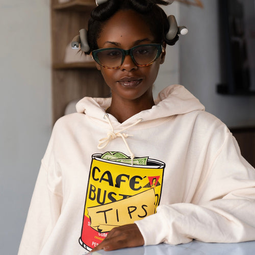 Woman wearing a hoodie with a 'Cafe Bustelo Tips' design.